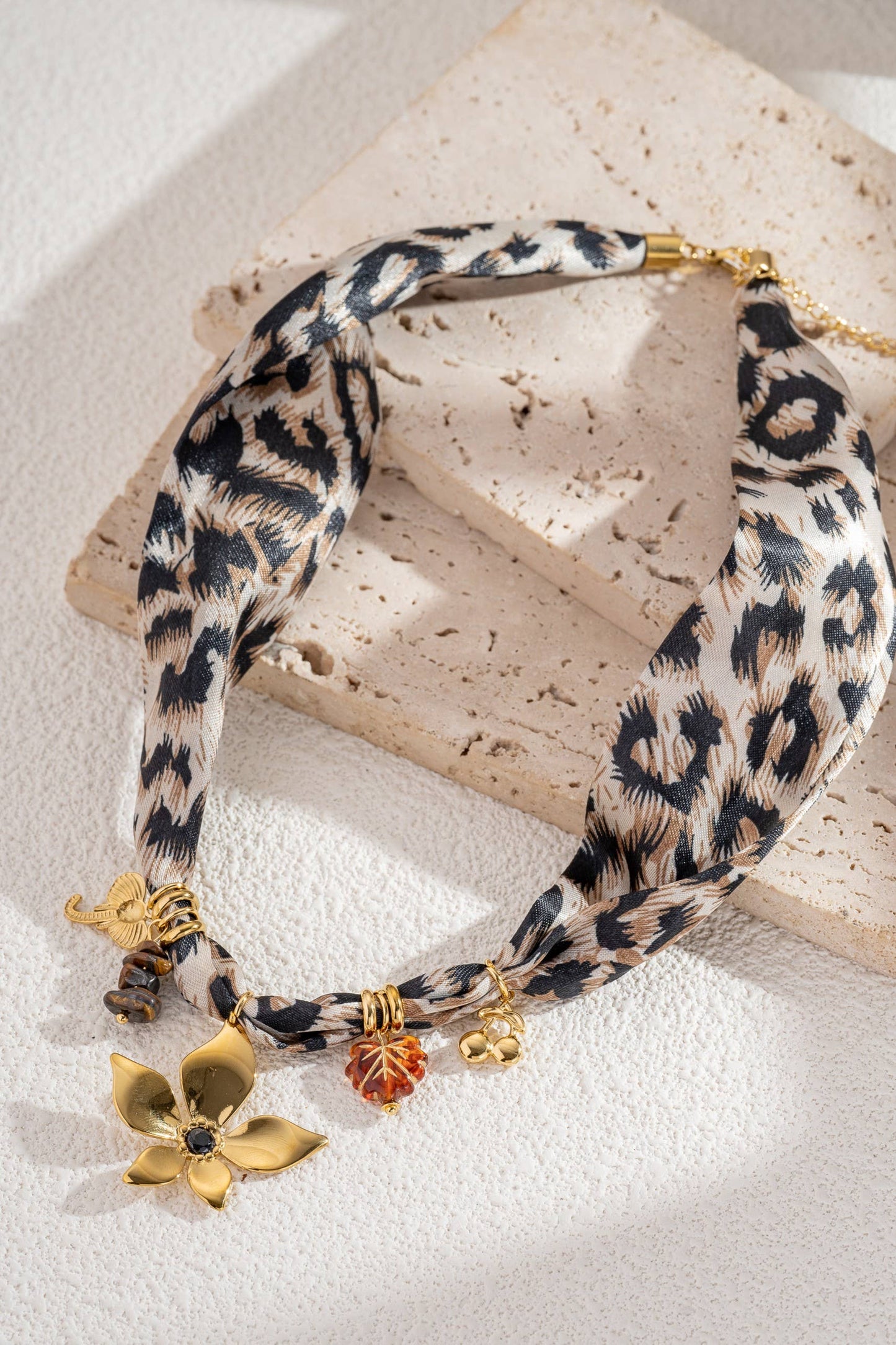Kenza Leopard necklace in fabric and stainless steel, gold charms